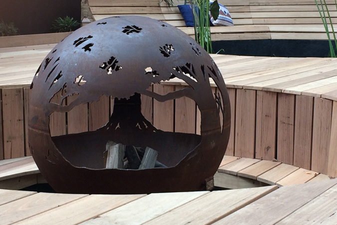 A striking firepit in the Dashing Fox Landscaping display garden